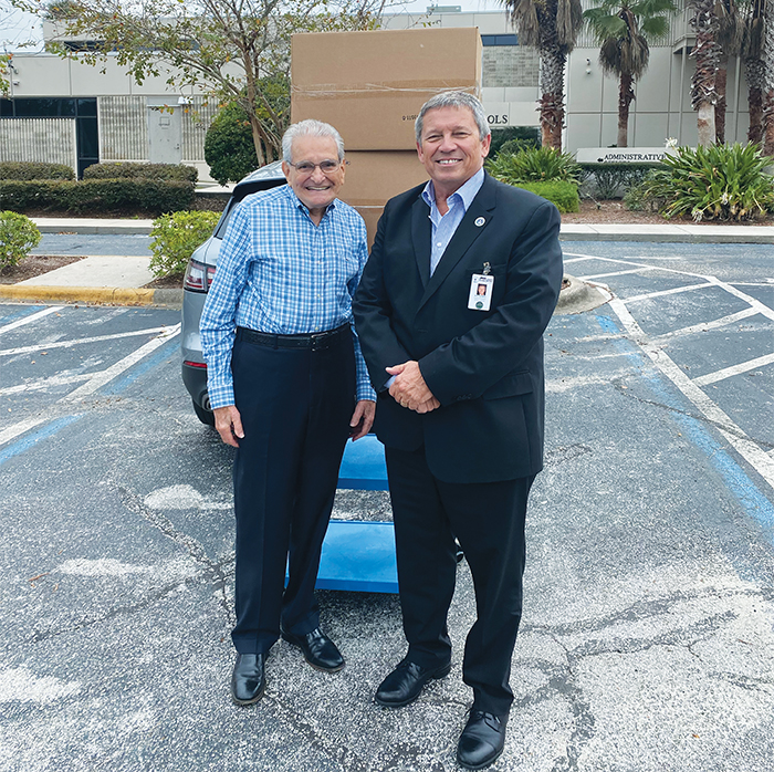 Danny Martinez, left, and Superintendent Rick Surrency stand outside of the Putnam County School District headquarters in Palatka.